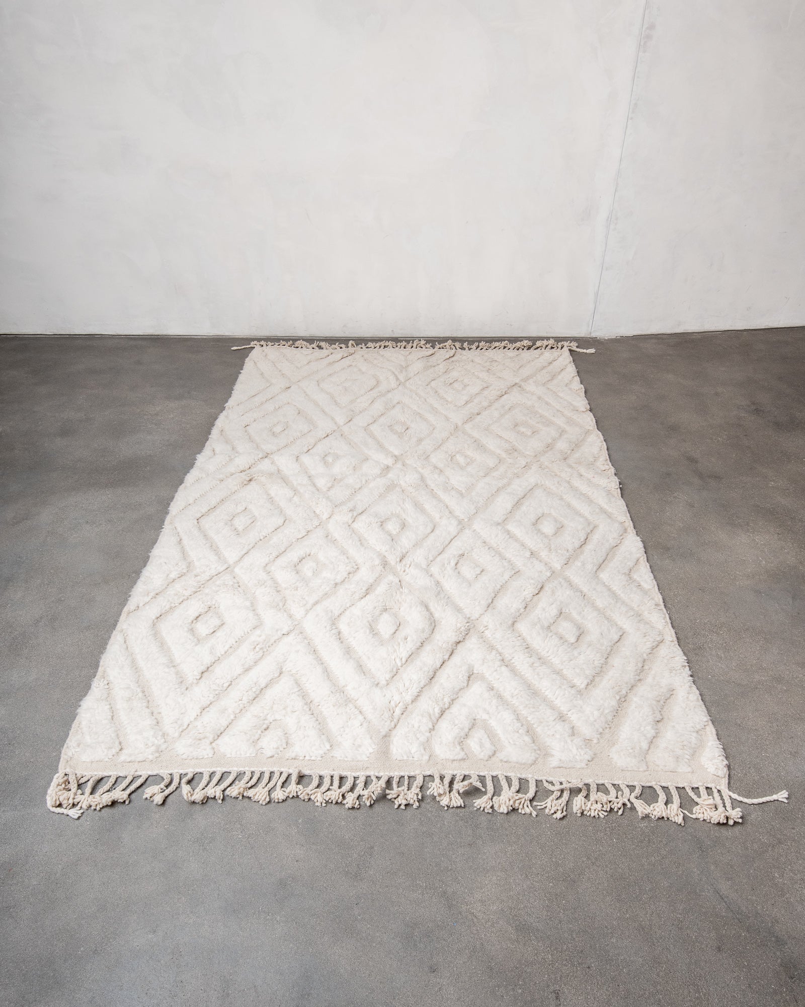 Modern, designer, handcrafted Berber rug from Morocco. Beniourain carpet with minimalist design, natural wool pile and a fluffy texture.